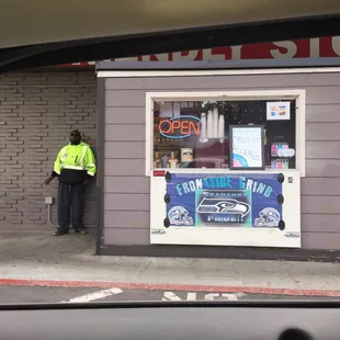 a man standing in front of a store