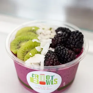 Dragon Bowl:  Base - banana, pitaya, mixed berries, lemon, almond milk  Toppings - blackberry, coconut, kiwi