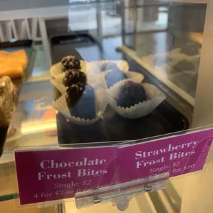 a display of chocolate frosted fruit bites