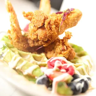 a plate of fried chicken and salad