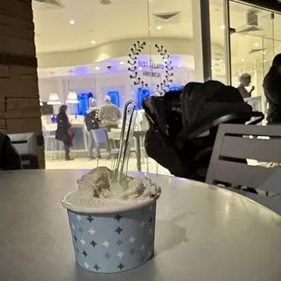 a cup of ice cream on a table