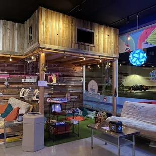 a living room with a loft bed