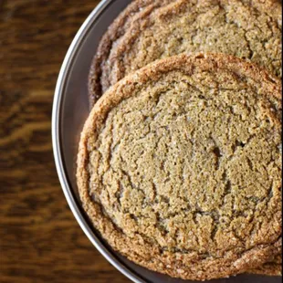 a plate of cookies on a wooden table