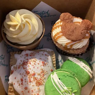 Pineapple whip, churro cupcake, pistachio macaron and strawberry pop tart.