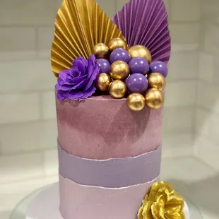 a purple and gold cake