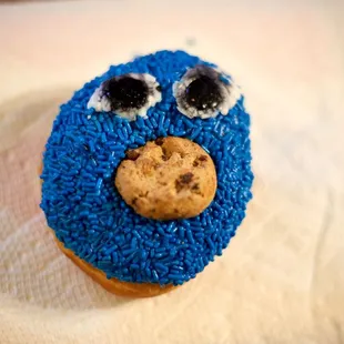 a blue cookie with eyes