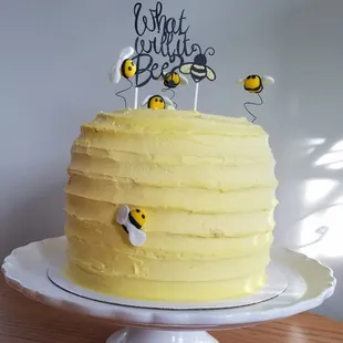 a cake with bees on top