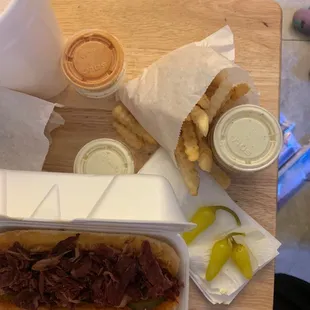 a sandwich and fries on a table