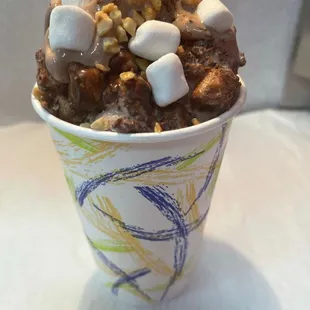 a cup of ice cream with marshmallows