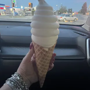 Vanilla ice cream in a waffle cone.
