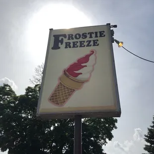 an ice cream cone on a sign