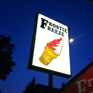 a neon sign for a frozen treat