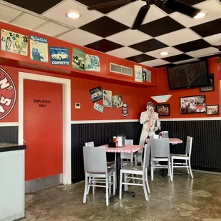 a woman standing in a restaurant