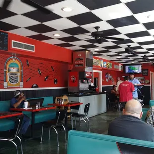 diners sitting at tables in a diner