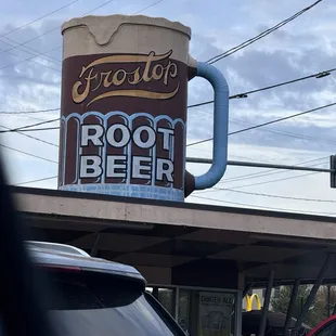 The big mug that spins on top of restaurant.