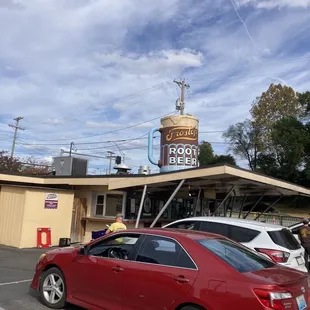 a red car in a parking lot