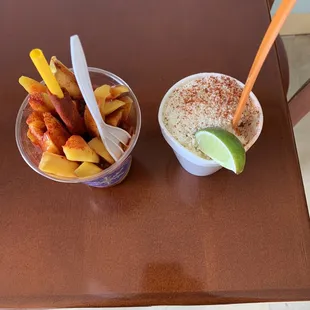 Mangolada and corn in a cup.