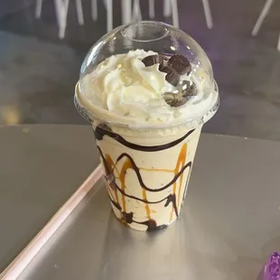 Vanilla shake with whip cream on top and some Carmel cups added the look like really good and taste osm