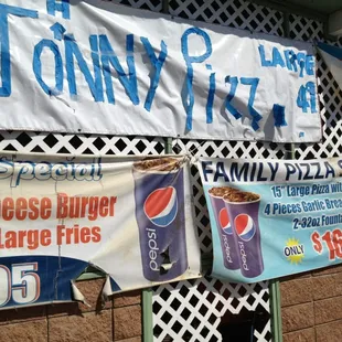 a variety of signs on the side of a building