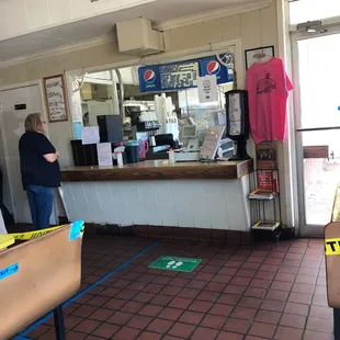 a woman standing at the counter