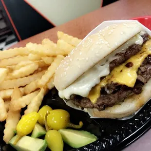 Double burger with Grilled onions with Swiss cheese and American cheese  looks fire