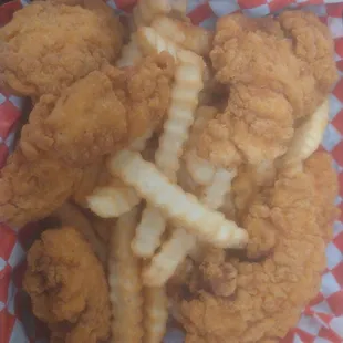 a basket of fried chicken and french fries