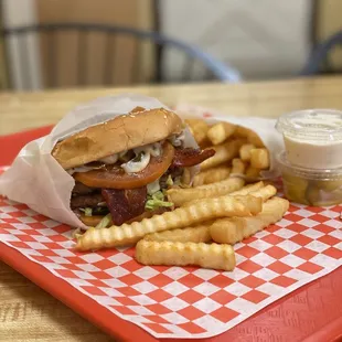a burger and fries on a tray