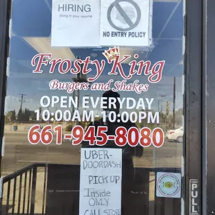 closed sign in window of restaurant