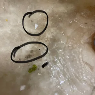 Dirt, gravel, sand the green would be lettuce.