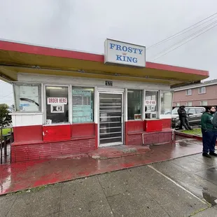 a man standing in front of a store