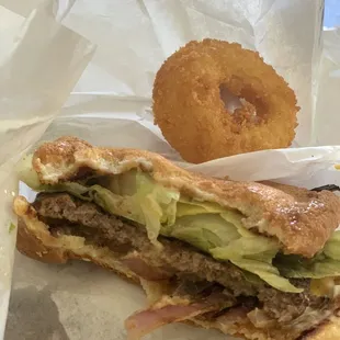 Bacon cheeseburger with onion rings, and a cookies and cream milkshake