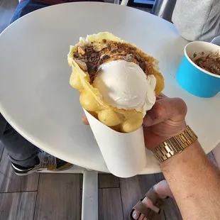 Puffy waffle cone, with cheesecake custard and heath and butterfinger pieces...