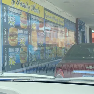 a car parked in front of a restaurant