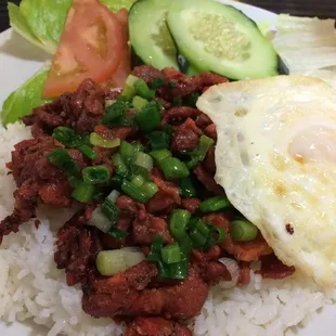 Charbroiled pork and fried egg rice plate