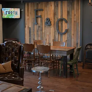 a rustic dining room with a rustic table and chairs