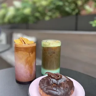 a donut and a drink on a table