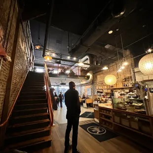 a man standing in a coffee shop