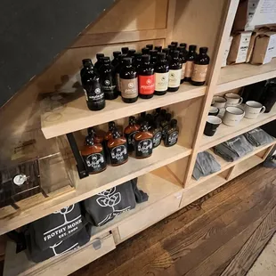 a shelf full of bottles of beer