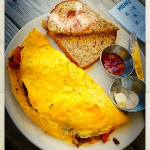 Omelette with mushroom and bacon wheat toast and butter and jelly - not to mention the mimosa (3) did the job