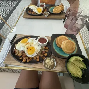 Corn beef skillet with avocado added and short stacks (closest in picture)