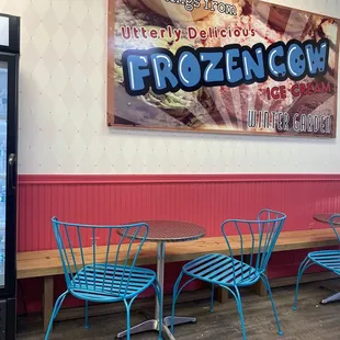 blue chairs and a sign