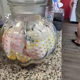 a glass jar filled with candy