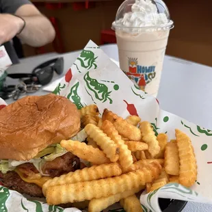 a burger and french fries on a table