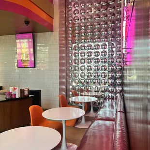 the inside of a restaurant with tables and chairs