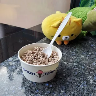 a bowl of cereal and a spoon
