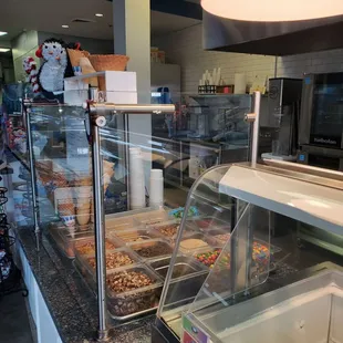 a variety of donuts in a display case