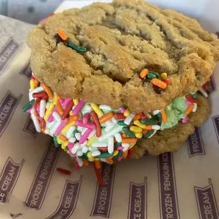 Chocolate chip cookie sandwich with mint chocolate chip ice cream and sprinkles