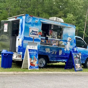 a frozen treat truck parked on the side of the road