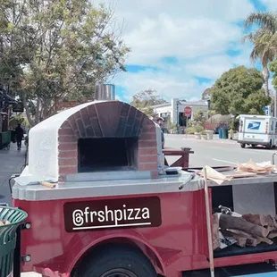 a truck with a pizza oven