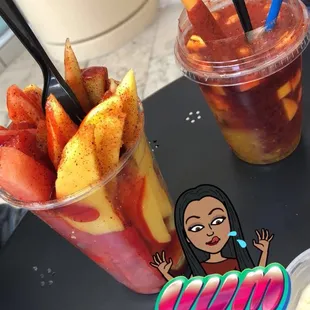 a woman sitting at a table with a bowl of fruit and a cup of yogurt